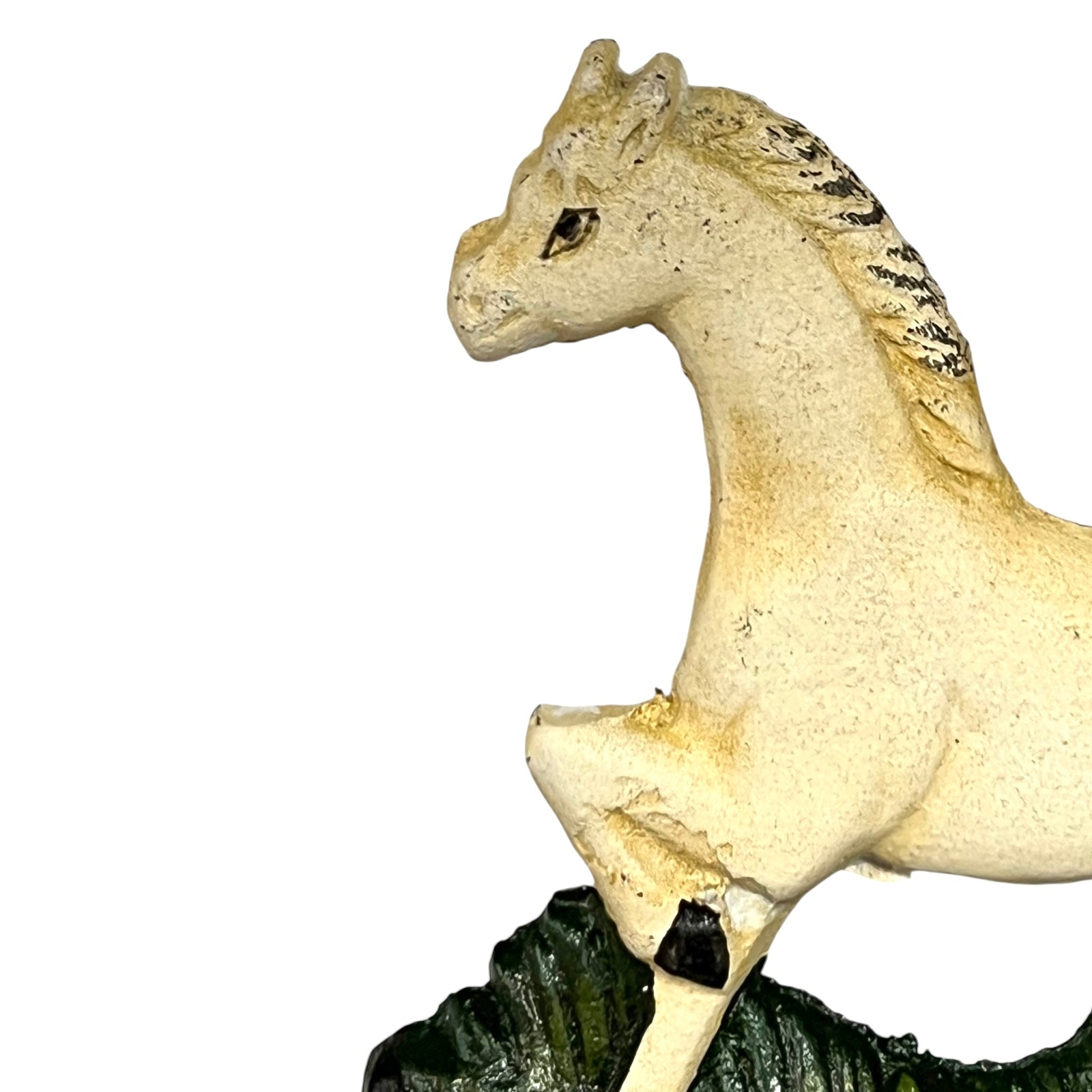Close up of white horse toilet paper holder against a white background
