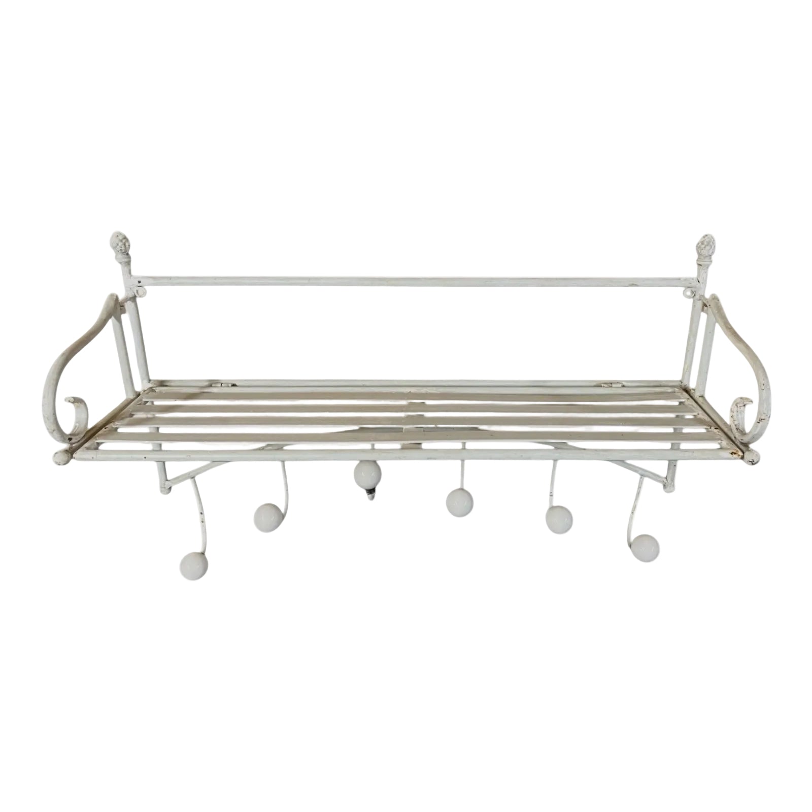 White metal wall shelf with hooks on a white background