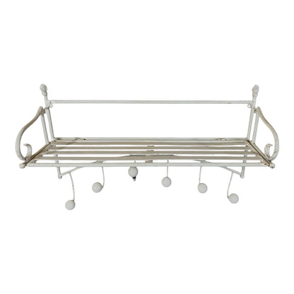 White metal wall shelf with hooks on a white background