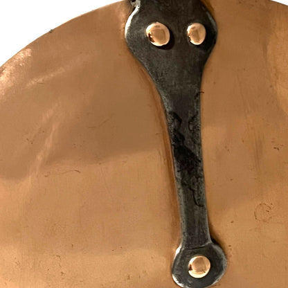 cast iron handle with copper rivets of copper pan lid