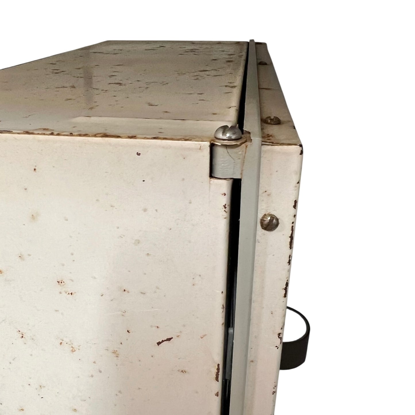 close up of a vintage metal bathroom cabinet on a white background