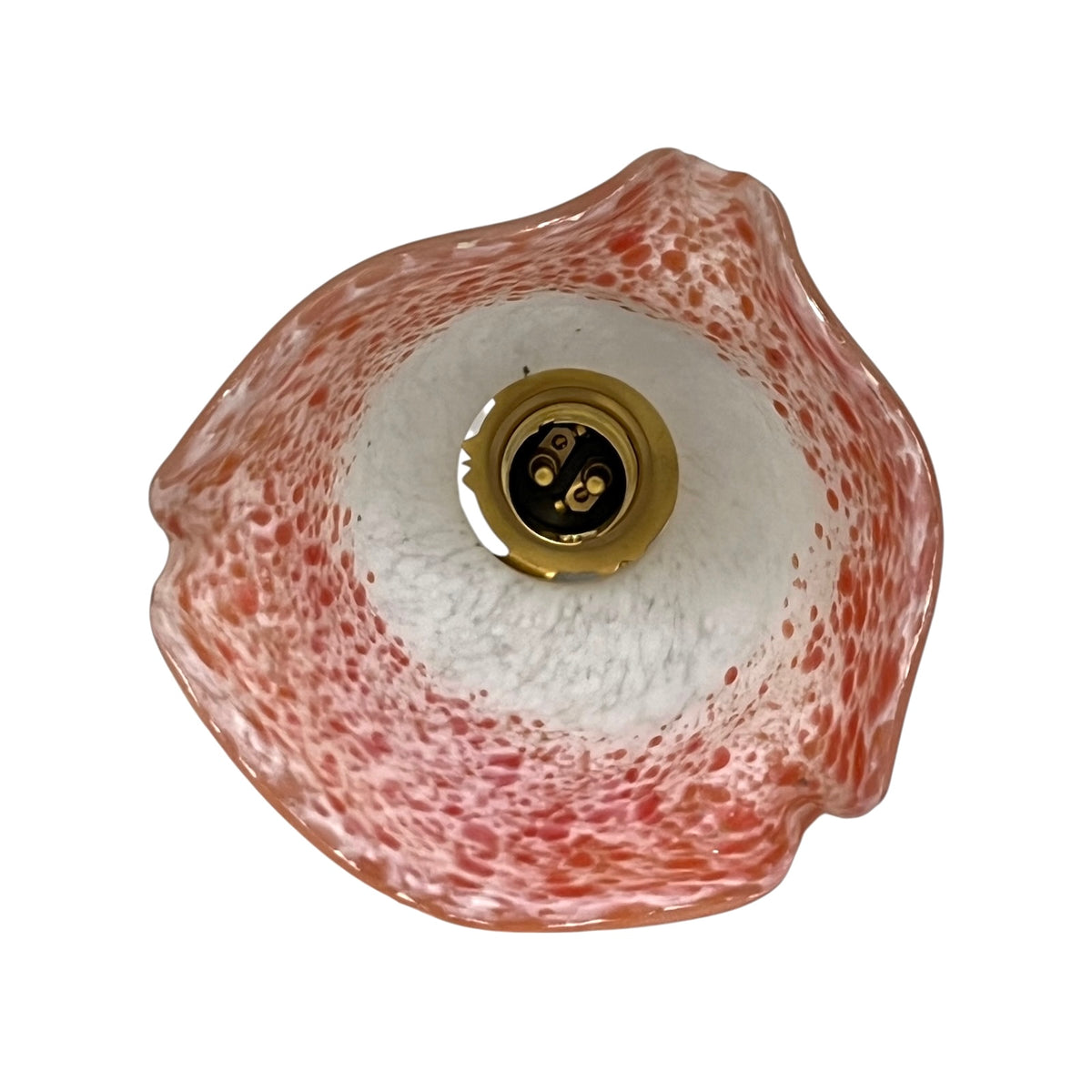 Inside view of a glass lampshade and brass bulb holder displayed on a white background 