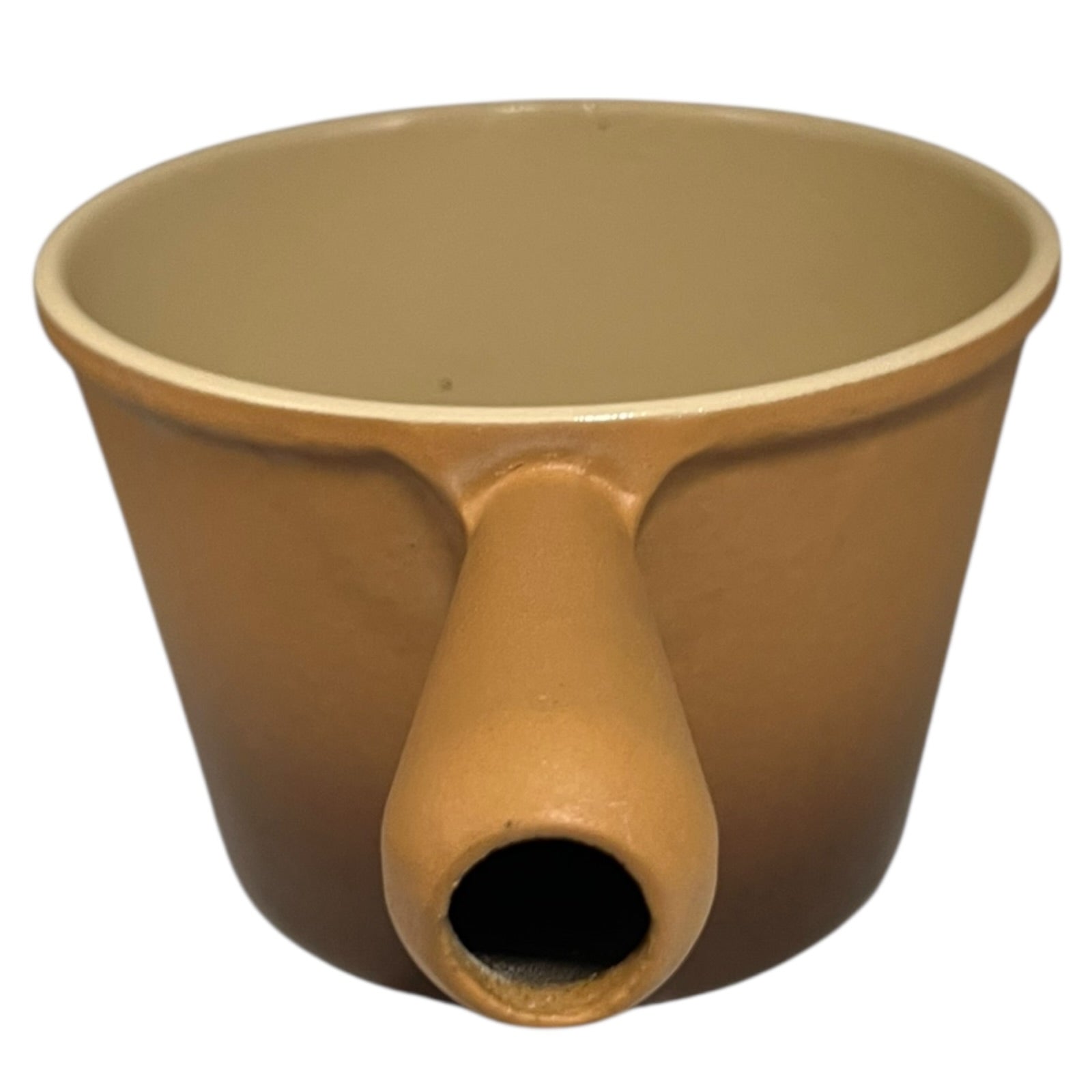 Brown Le Creuset vintage saucepan with handle on a white background