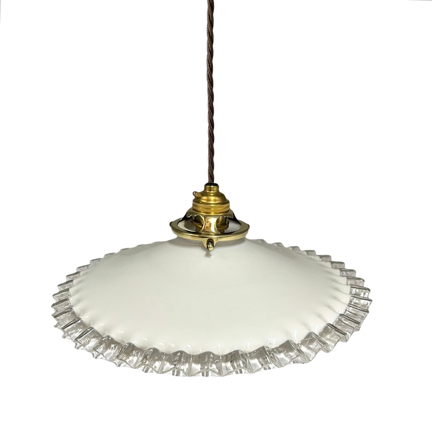 A vintage-style pendant light with a white glass shade featuring a fluted, ruffled edge and a polished brass metal fixture, suspended from a dark brown cord against a plain white background.