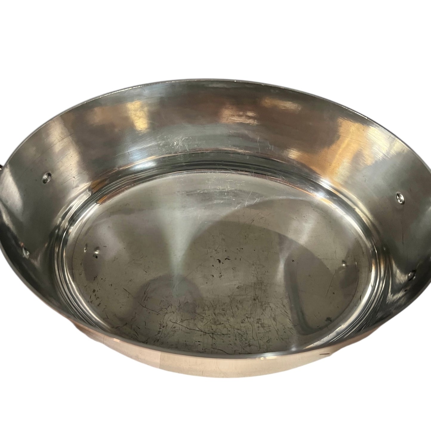 Close-up of the inner of a  copper pot handle on a white background