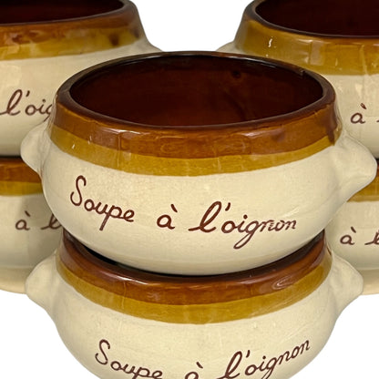 close up of French writing on onion soup bowl