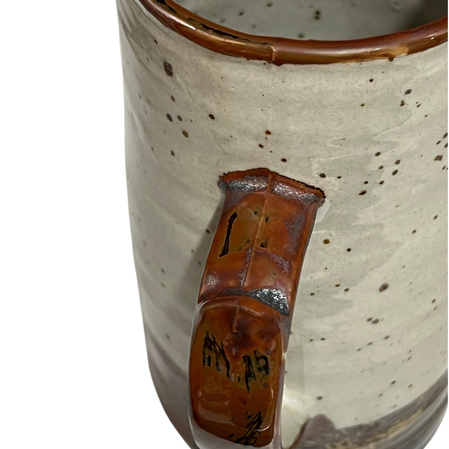 close up of ceramic glazed pitcher jug on a white background 