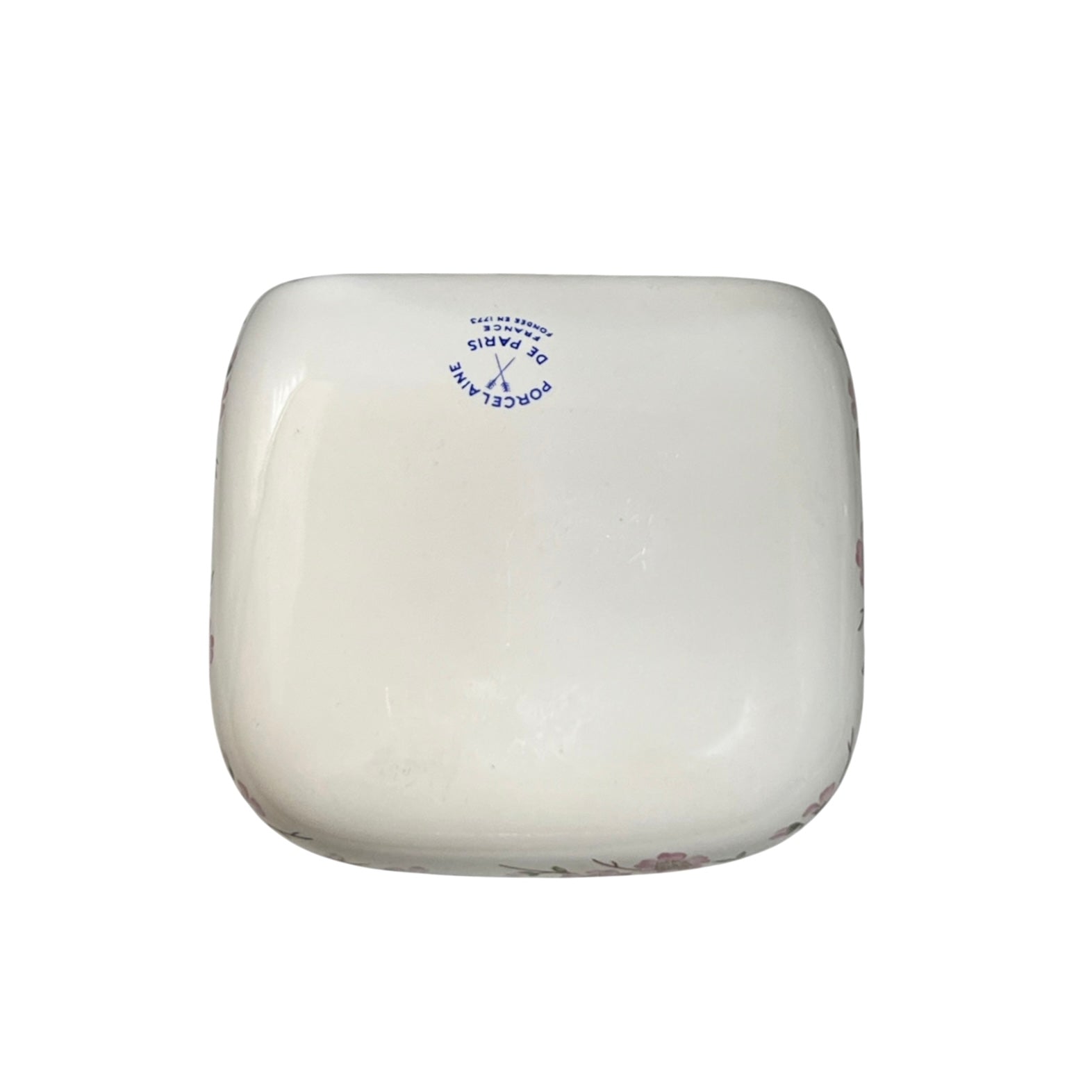 A rectangular soap shelf back featuring the phrase Porcelaine de Paris displayed against a light gray background.