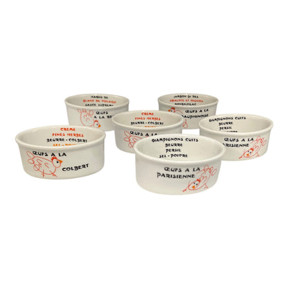 Set of ceramic ramekins with various French text and illustrations on a white background