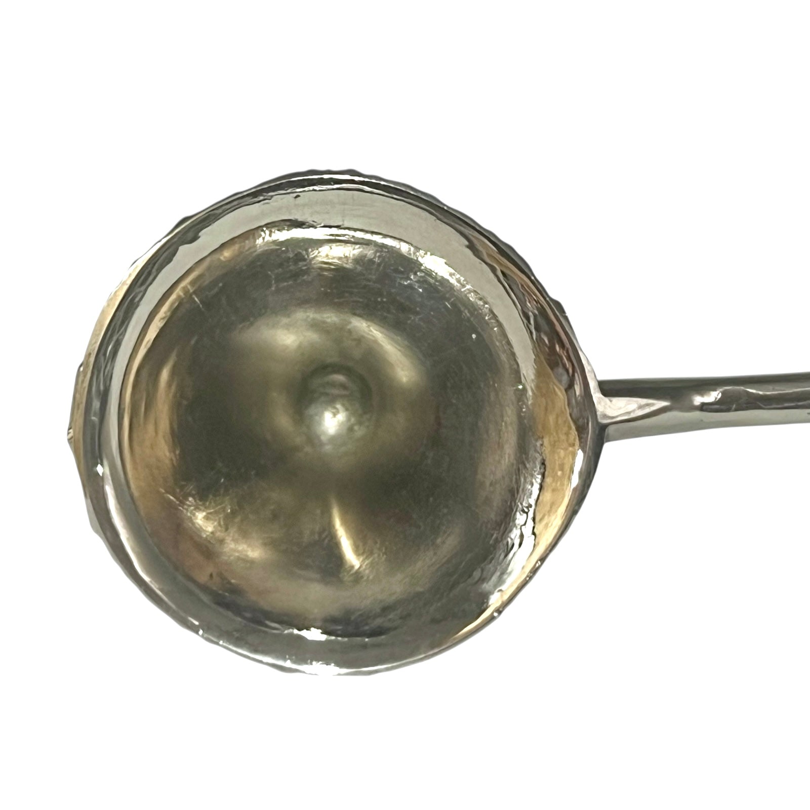 close up of a decorative Christmas tree shaped silver candle snuffer on a white background