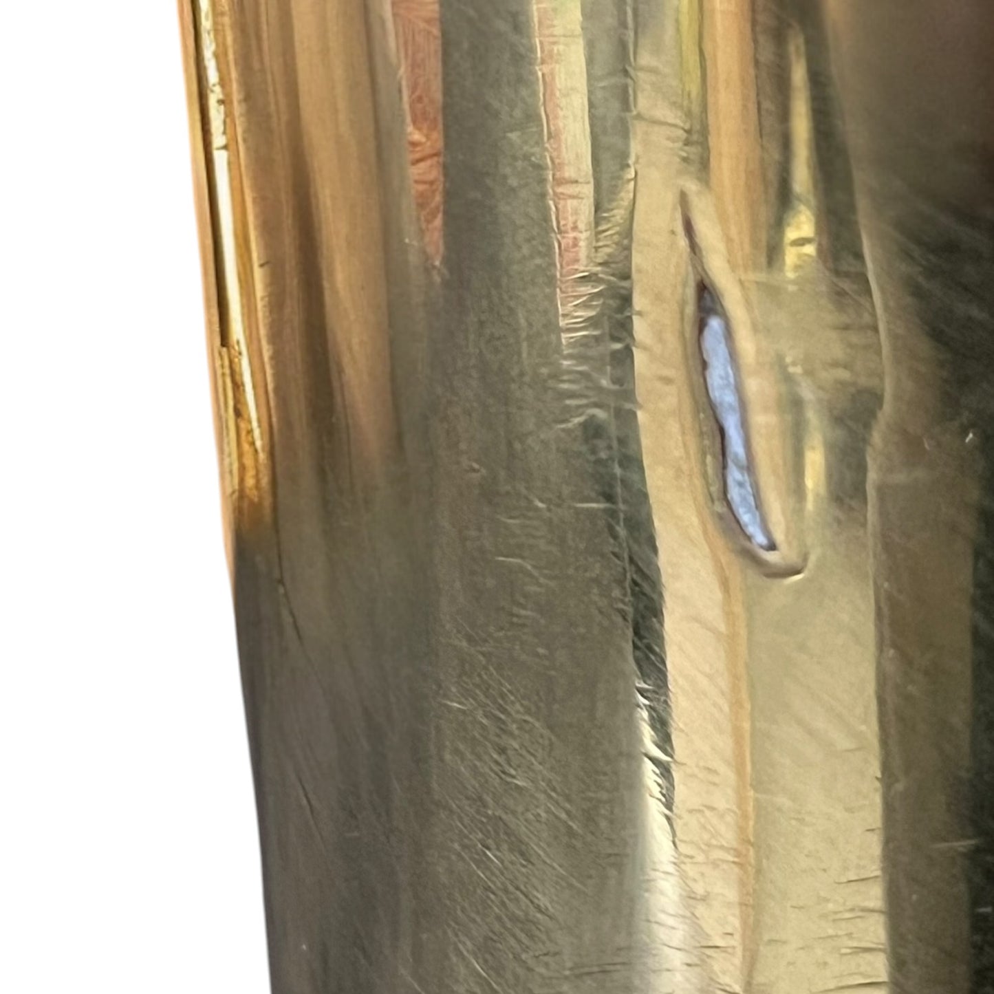 Close-up of a brass trench art shell case on a white background 