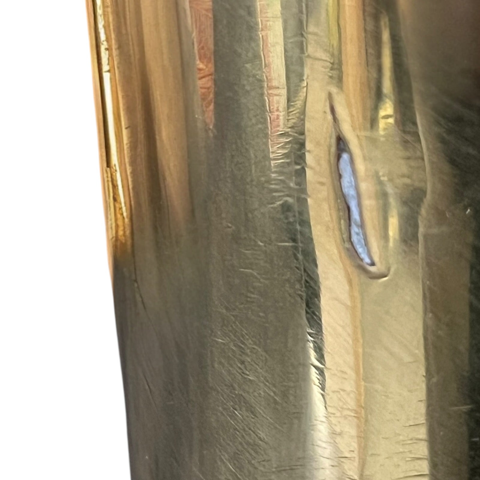 Close-up of a brass trench art shell case on a white background 