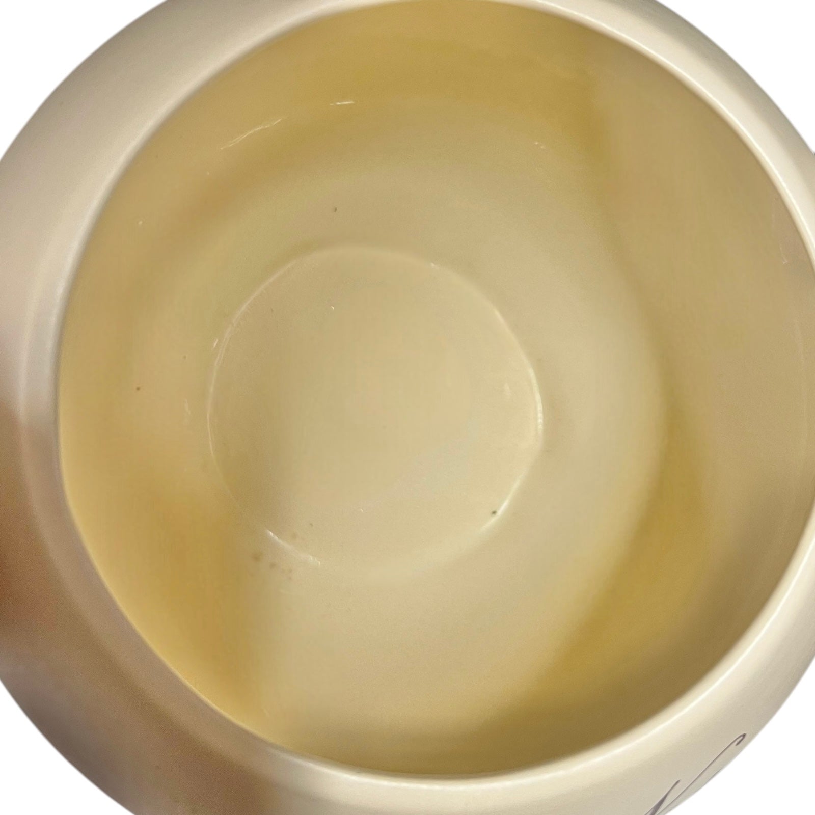 Close-up of a beige ceramic bowl on a white background