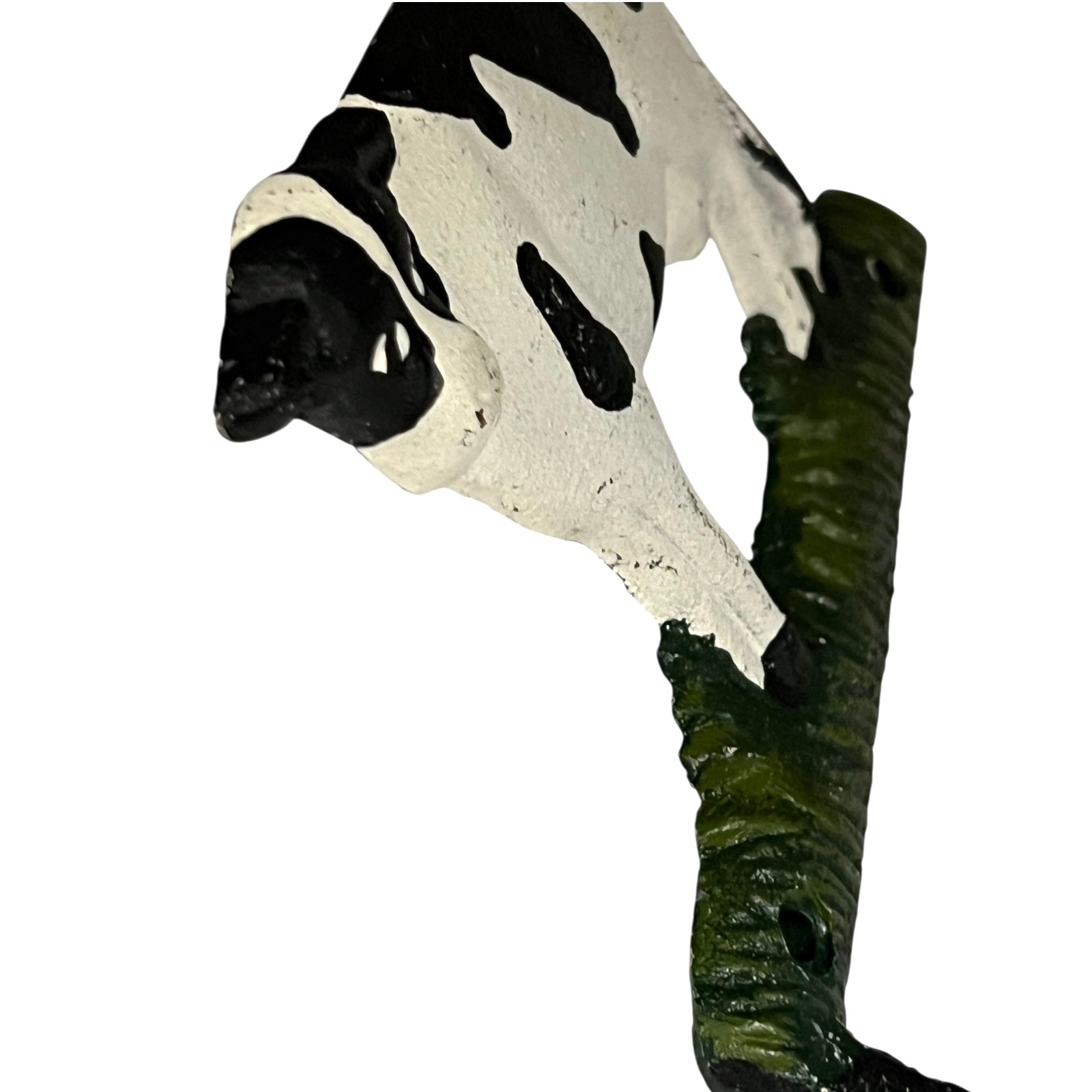 Close-up of a cow-shaped toiler paper roll holder  on a white background