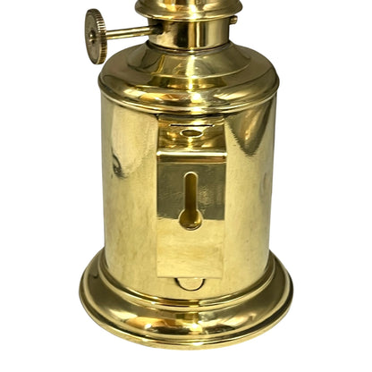 Brass oil lamp on a white background