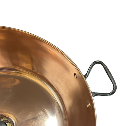 Close up of a copper sink on a white background 