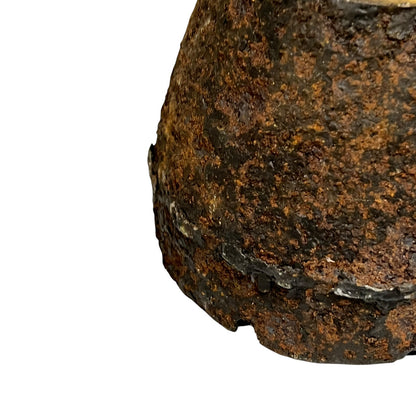 Close up of WW1 brass fuse on a white background
