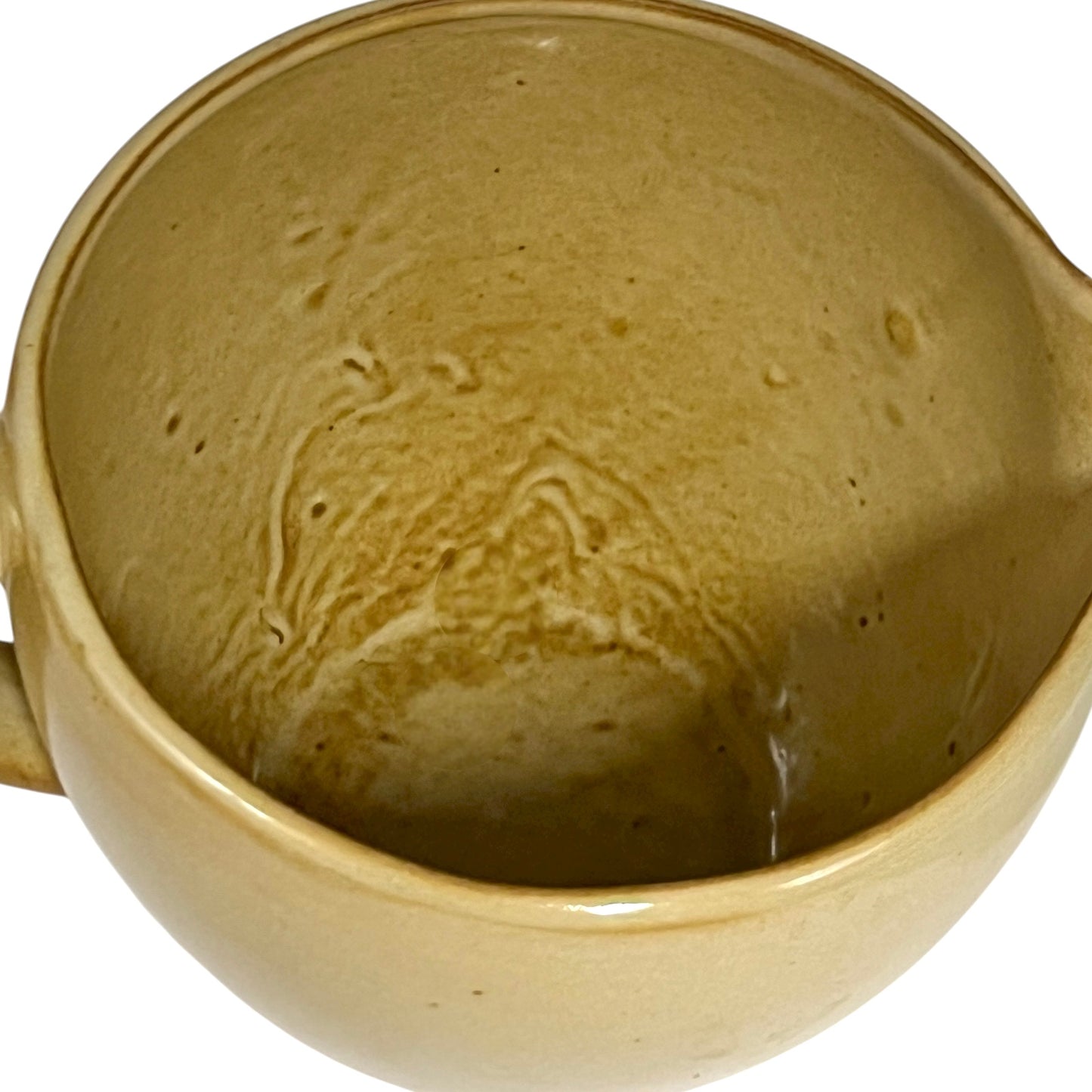 Close up of ceramic pitcher with 'eau fraiche' text on a white background