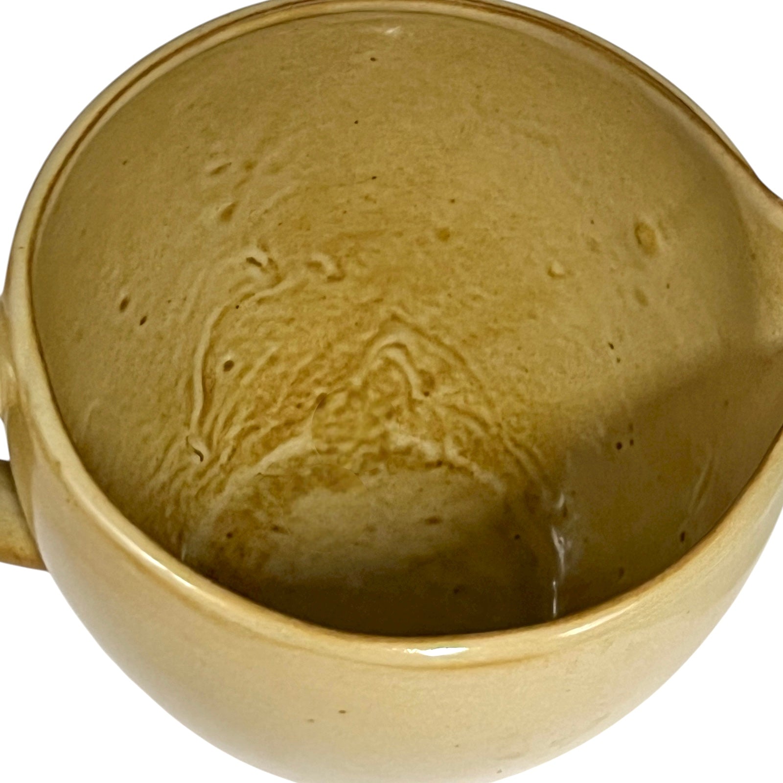 Close up of ceramic pitcher with 'eau fraiche' text on a white background