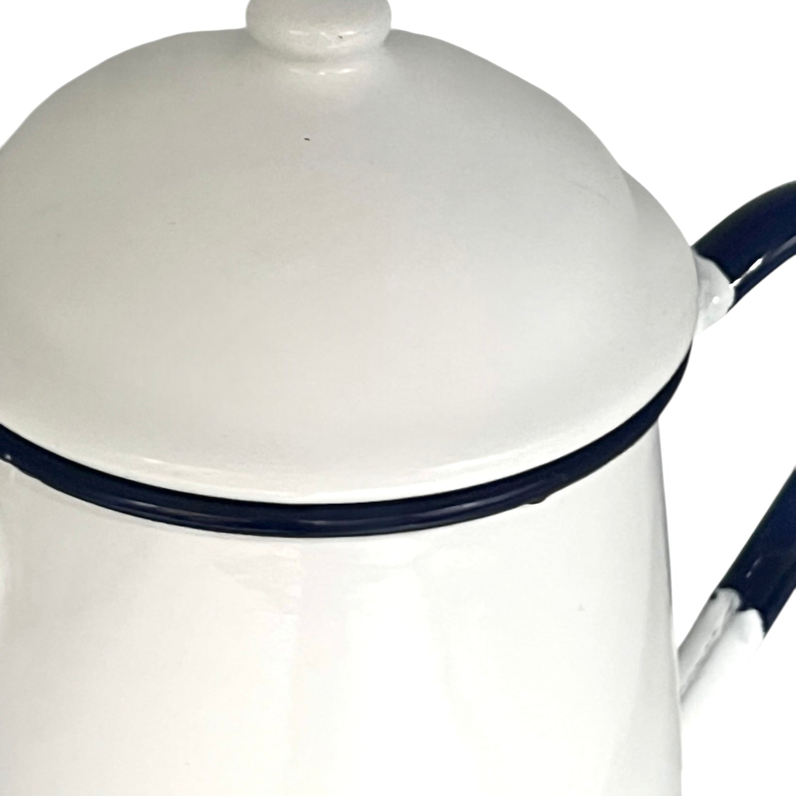 Close up of an enamel coffee pot on a white background