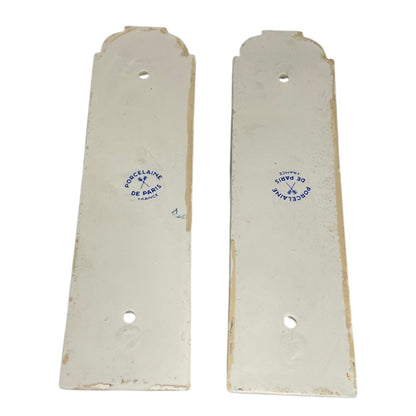 close up of door push plate with a Paris makers stamp on a white 