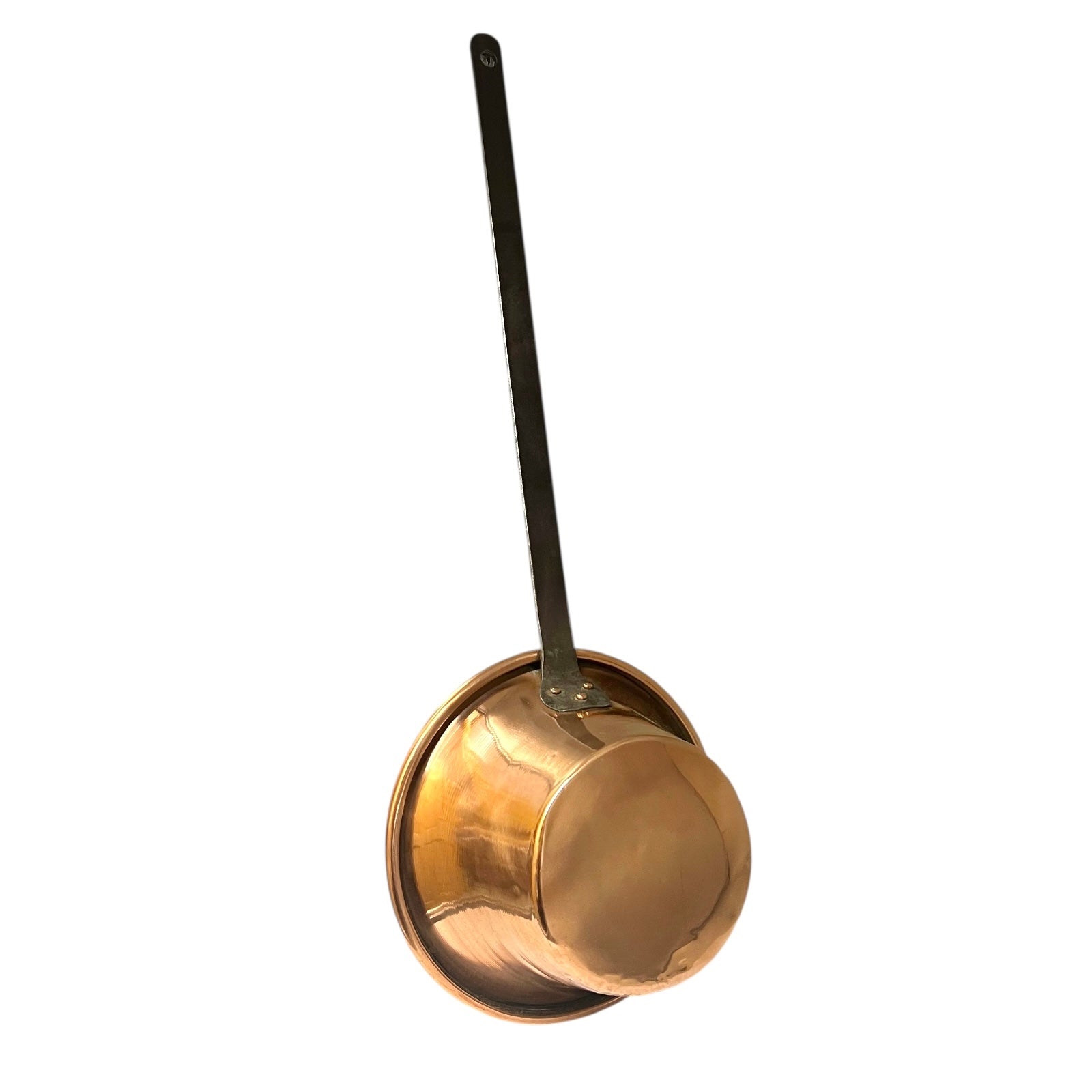 French vintage copper ladle pan with a black handle on a white background