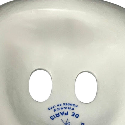 Porcelain bathroom toothbrush holder  featuring green leaf patterns on a white background
