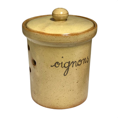 A handmade ceramic canister with a matching lid, featuring a speckled beige and yellow glaze, a brown rim, and the word 'oignons' written in black cursive on the side.