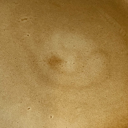 close up of brown ceramic plate 