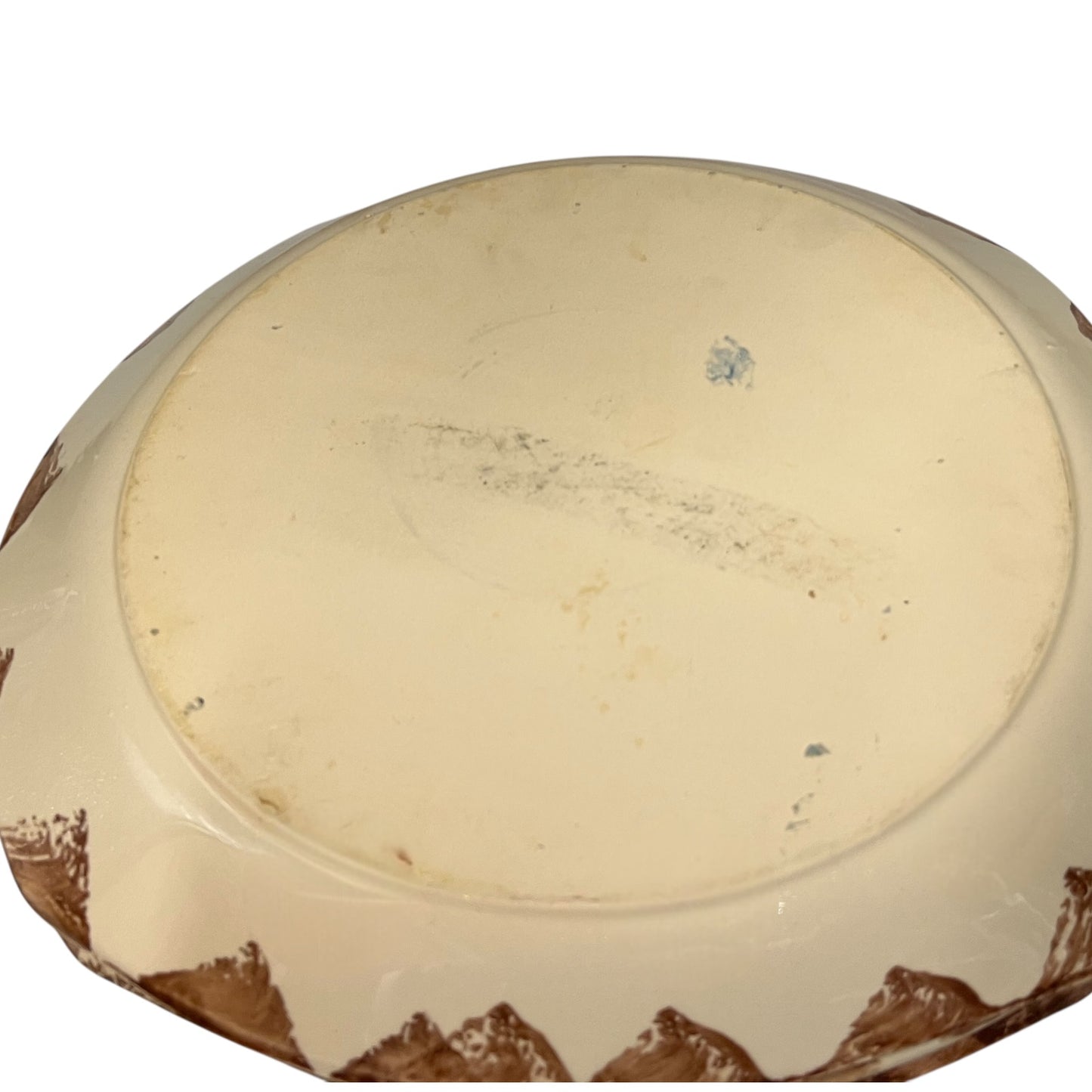 Reverse of a French dinner plate on a white background
