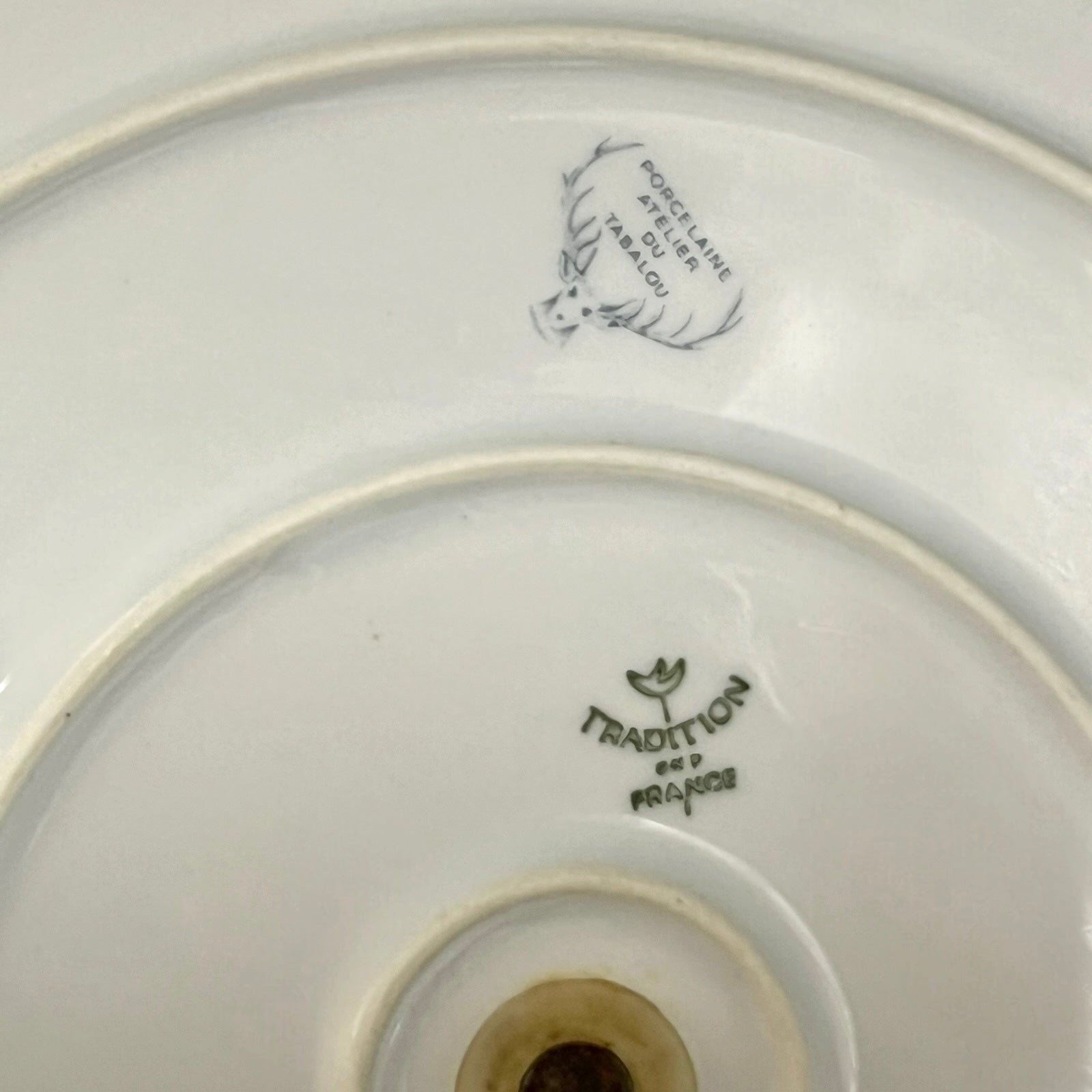 back of a French cheeseboard with a makers stamp on a white background 