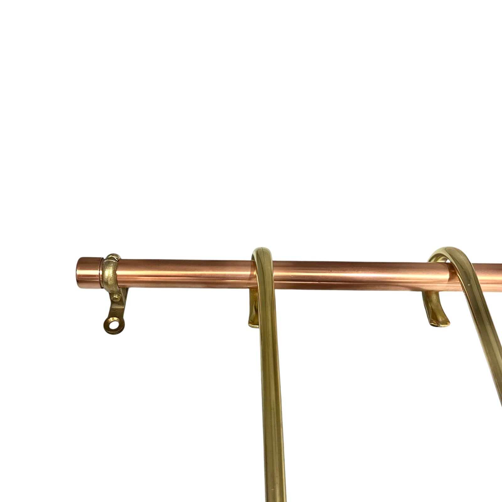 Close-up of a brass rack showing a copper rod with gold-toned hooks and a hanging rod section against a plain white background.