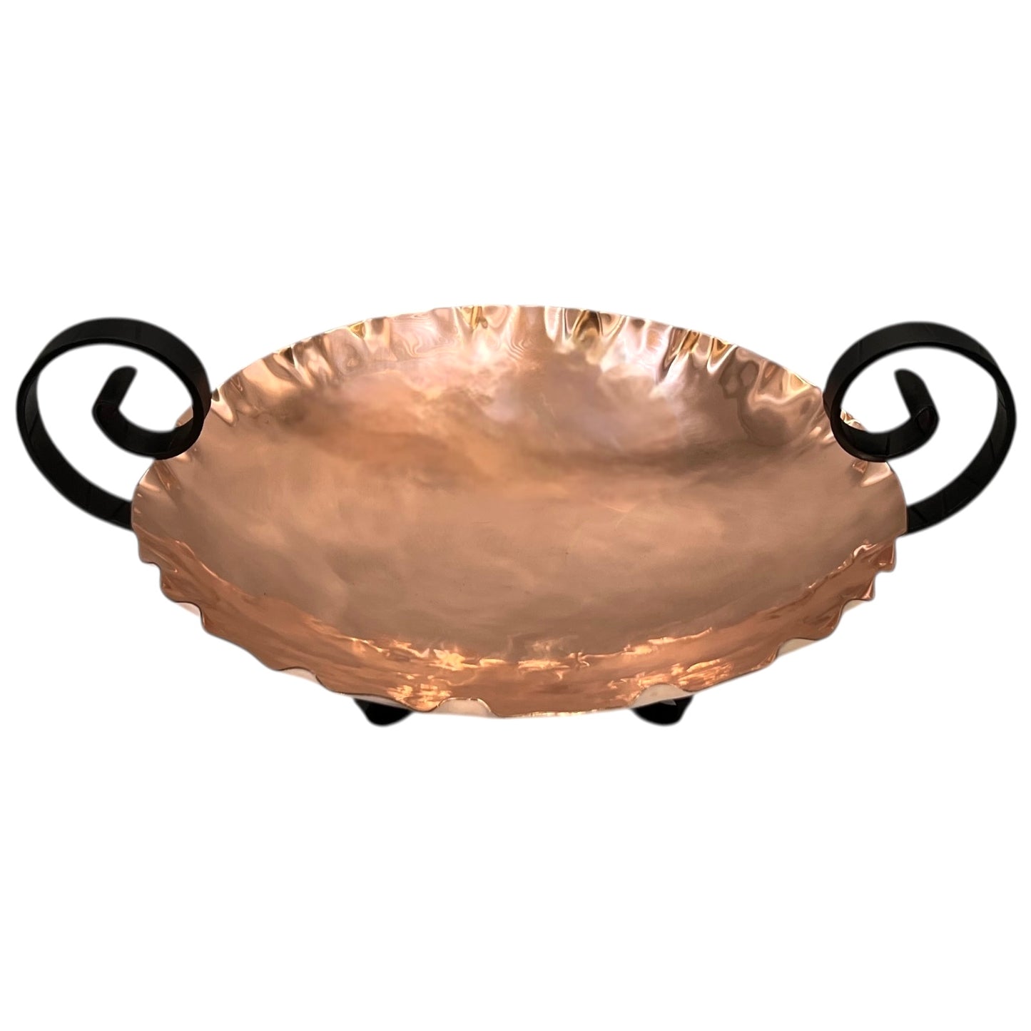 Copper fruit bowl with black handles on a white background