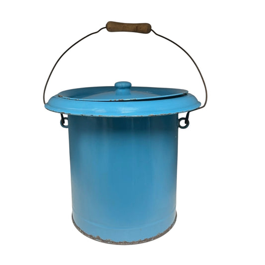 Blue metal bucket with a wooden handle on a white background