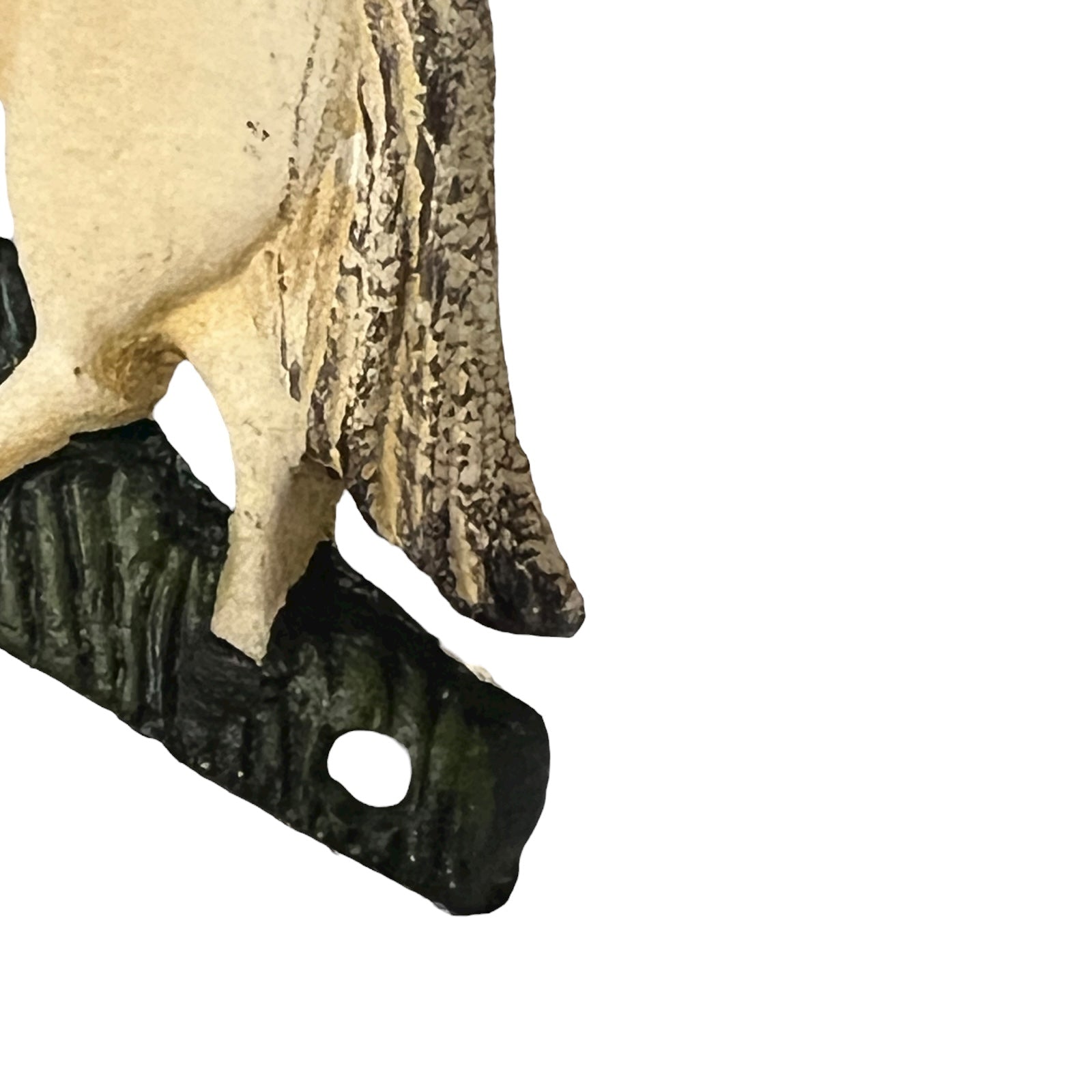 close up of cast iron toiler roll holder on a white background