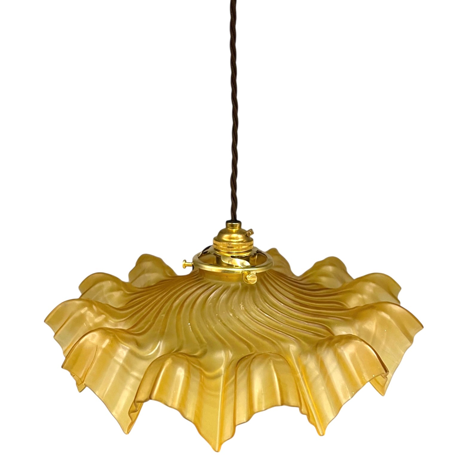 Amber coloured vintage French  pendant light with a scalloped design on a white background