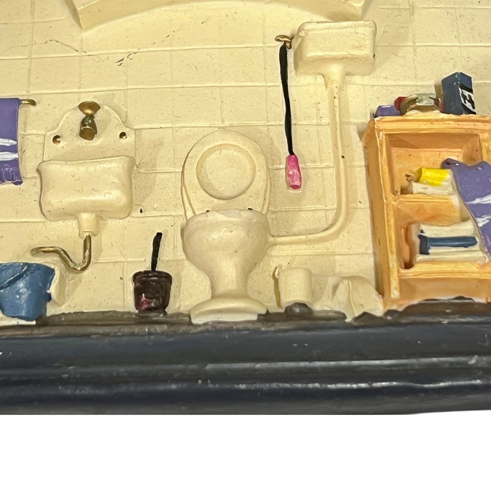 Close-up of a toilet door sign on a white background