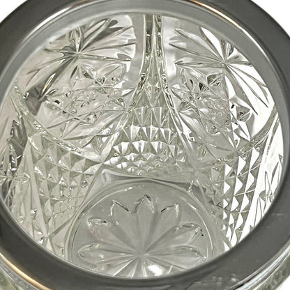 Close up of a decorative glass vintage ice bucket on a white background