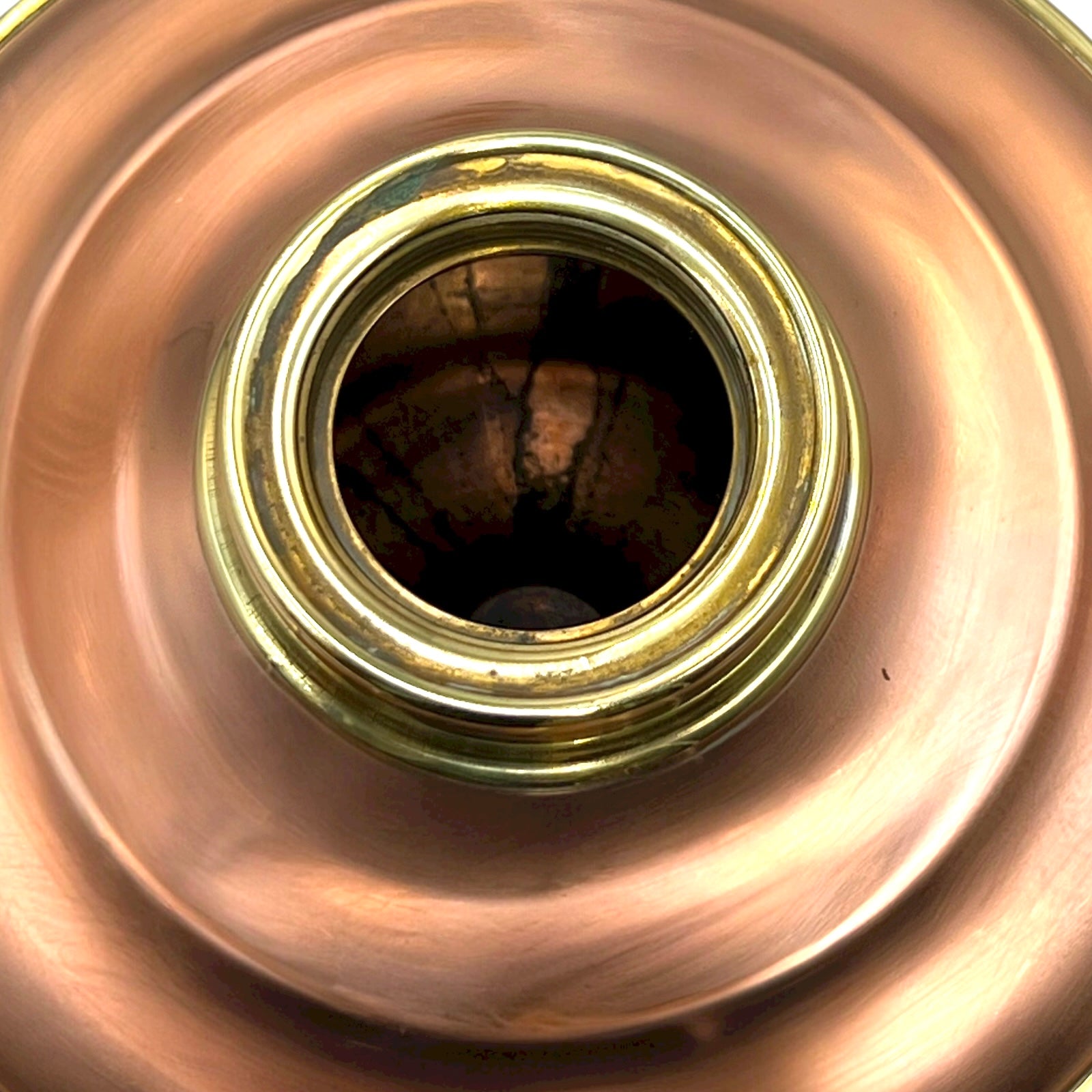Close-up of a copper and brass lamp