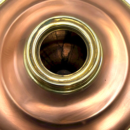 Close-up of a copper and brass lamp