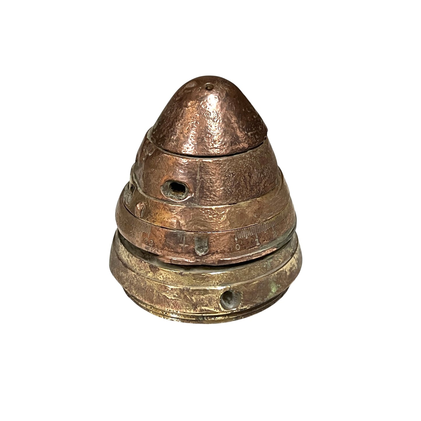 WW1 brass fuse now repurposed as a paperweight, with markings for identification of wear, on a white background