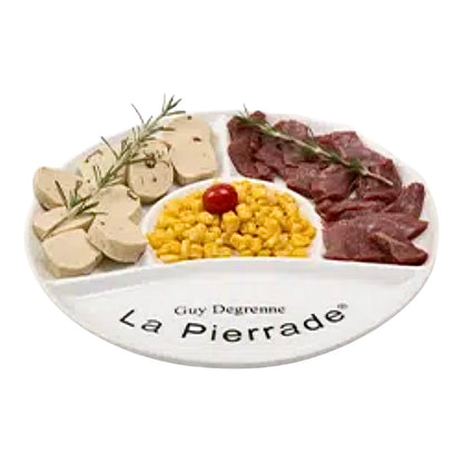 White La Pierrade plate with a selection of foods in each section on a white background