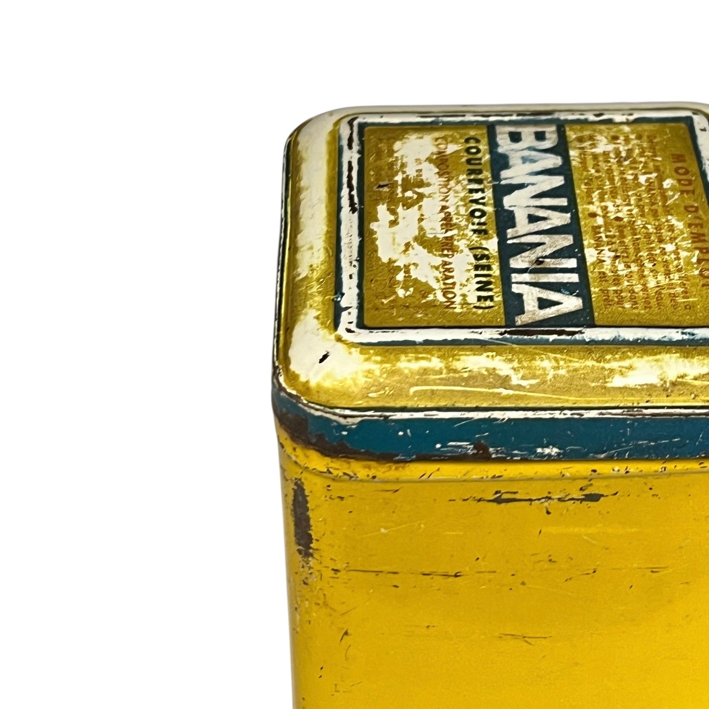 Vintage tin can with a colourful design featuring a face and 'Banania' branding on a white background.