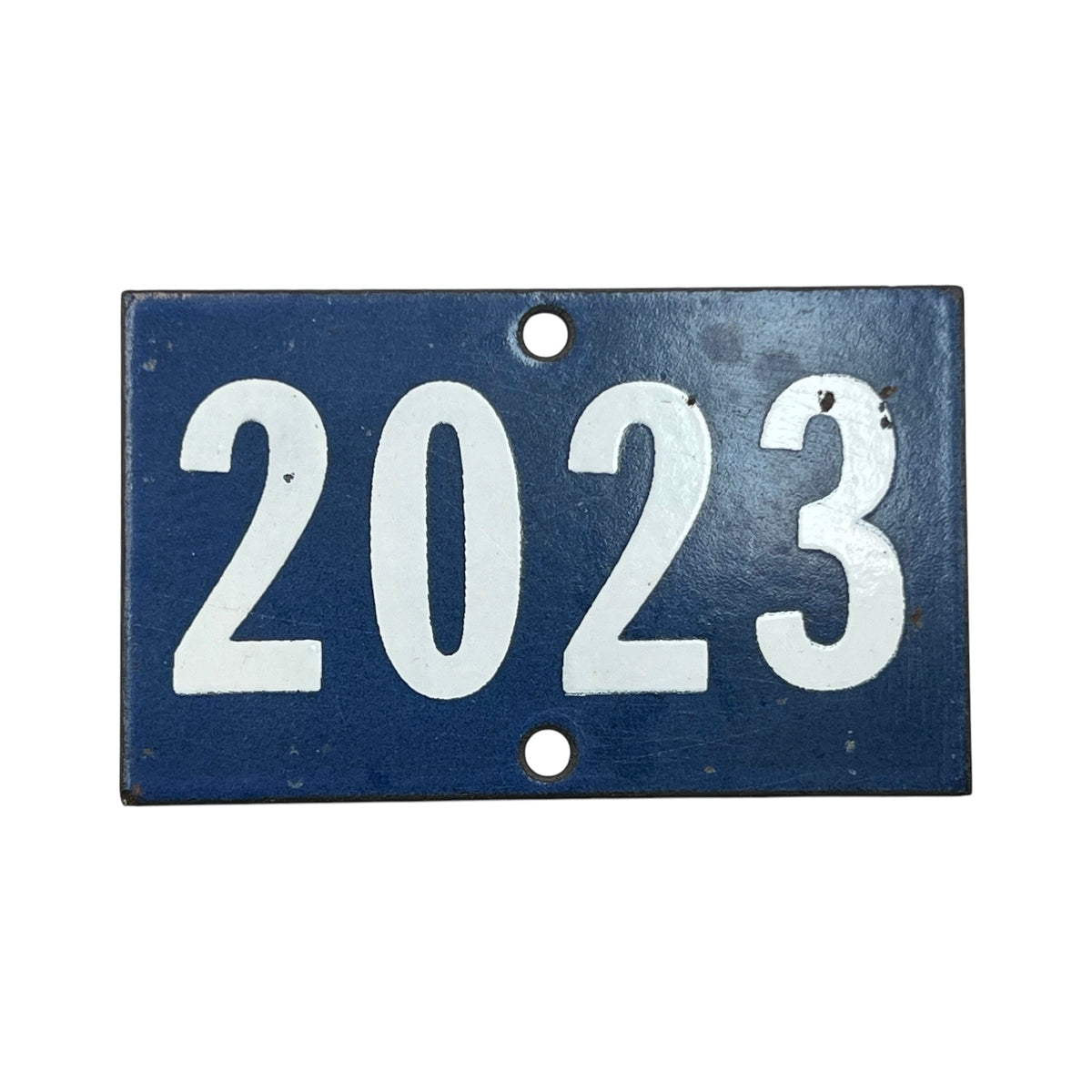 A rectangular vintage-style blue metal house number plaque with the year '2023' in raised white numerals, shown on a plain white background.