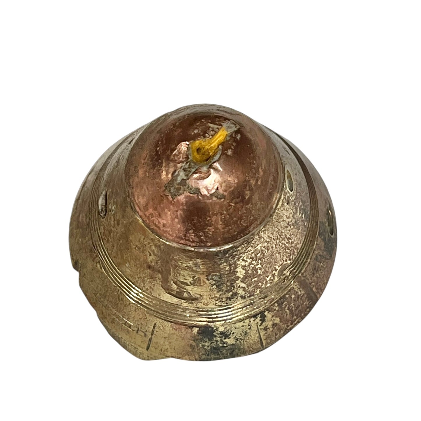 Close up of WW1 relic brass fuse on a white background