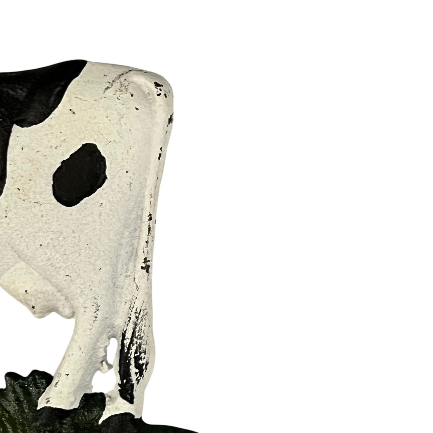 Close-up of a cow-shaped toiler paper roll holder  on a white background