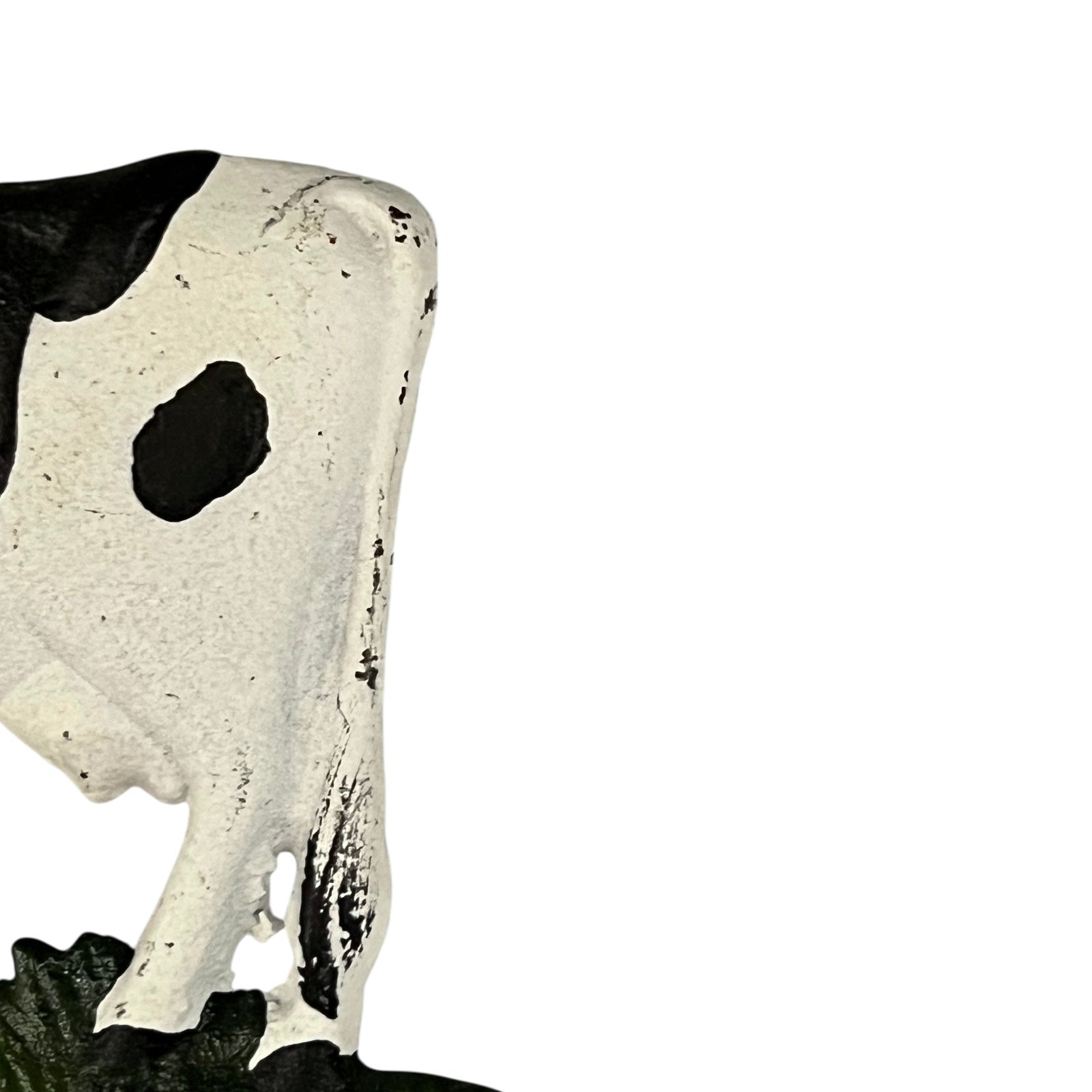 Close-up of a cow-shaped toiler paper roll holder  on a white background