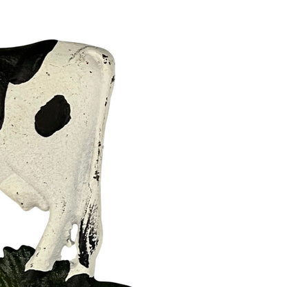 Close-up of a cow-shaped toiler paper roll holder  on a white background