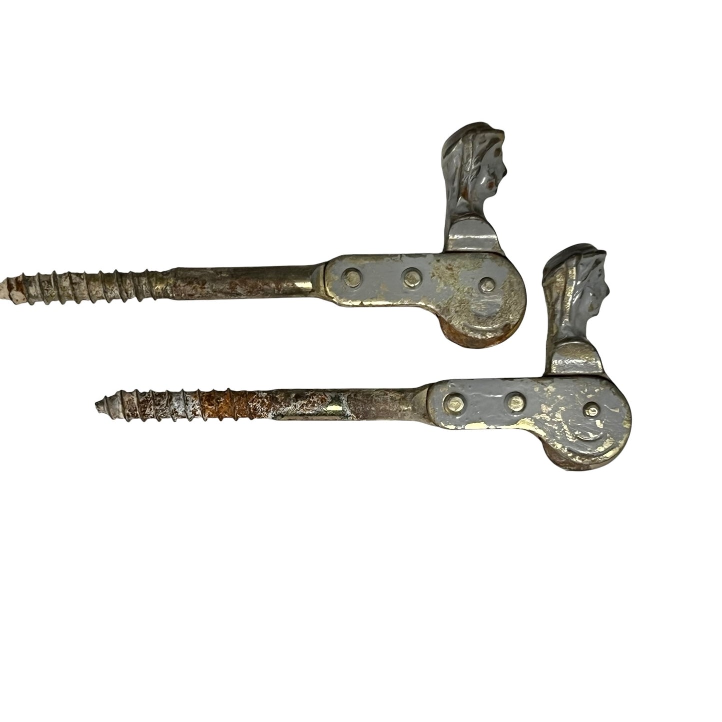 Two rusty metal Belgian ladies shutter dogs on a white background
