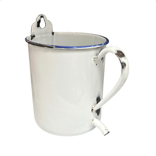 A white enamel mug with a blue rim, featuring a metal carrying loop on the top and a curved metal spout on the side, shown against a plain white background.